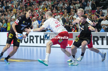 2024-01-26 - Julian Köster of Germany and Simon Hald Jensen of Denmark during the Men's EHF Euro 2024, Semi Finals handball match between Germany and Denmark on January 26, 2024 at Lanxess-Arena in Cologne, Germany - HANDBALL - MEN'S EHF EURO 2024 - GERMANY V DENMARK - HANDBALL - OTHER SPORTS