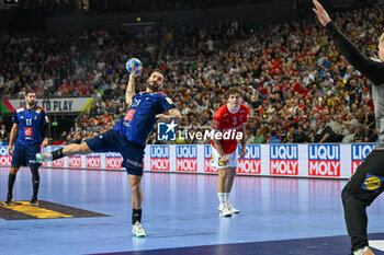 2024-01-28 - 7m throw Hugo Descat (France) during 2nd and 1st place final of the Men’s EHF Euro 2024 match between France vs Denmark at the Lanxess Arena, Cologne, Germany - MEN'S EHF EURO 2024 - FINAL - FRANCE VS DENMARK - HANDBALL - OTHER SPORTS