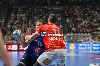 2024-01-28 - Kentin Mahe (France) in action against Rasmus Lauge Schmidt (Denmark) during 2nd and 1st place final of the Men’s EHF Euro 2024 match between France vs Denmark at the Lanxess Arena, Cologne, Germany - MEN'S EHF EURO 2024 - FINAL - FRANCE VS DENMARK - HANDBALL - OTHER SPORTS
