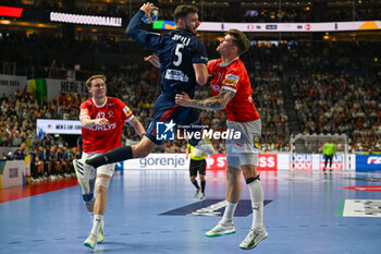 2024-01-28 - Nedim Remili (France) in action against Emil Jakobsen (Denmark) during 2nd and 1st place final of the Men’s EHF Euro 2024 match between France vs Denmark at the Lanxess Arena, Cologne, Germany - MEN'S EHF EURO 2024 - FINAL - FRANCE VS DENMARK - HANDBALL - OTHER SPORTS