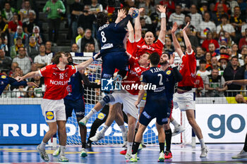 2024-01-28 - Elohim Prandi (France) jumps on Denmark team during 2nd and 1st place final of the Men’s EHF Euro 2024 match between France vs Denmark at the Lanxess Arena, Cologne, Germany - MEN'S EHF EURO 2024 - FINAL - FRANCE VS DENMARK - HANDBALL - OTHER SPORTS