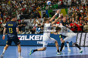 2024-01-28 - Jim Gottfridsson (Sweden) ina Christoph Steinert (Germany) during 3rd and 4th place final of the Men’s EHF Euro 2024 match between Sweden vs Germany at the Lanxess Arena, Cologne, Germany - MEN'S EHF EURO 2024 - PLACEMENT MATCH 3/4 - SWEDEN VS GERMANY  - HANDBALL - OTHER SPORTS