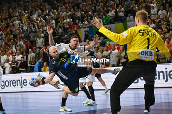 2024-01-28 - Oscar Bergendahl (Sweden) in action against David Spath (Germany) during 3rd and 4th place final of the Men’s EHF Euro 2024 match between Sweden vs Germany at the Lanxess Arena, Cologne, Germany - MEN'S EHF EURO 2024 - PLACEMENT MATCH 3/4 - SWEDEN VS GERMANY  - HANDBALL - OTHER SPORTS