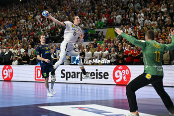 2024-01-28 - Juri Knorr (Germany) in action against Andreas Palicka (Sweden) during 3rd and 4th place final of the Men’s EHF Euro 2024 match between Sweden vs Germany at the Lanxess Arena, Cologne, Germany - MEN'S EHF EURO 2024 - PLACEMENT MATCH 3/4 - SWEDEN VS GERMANY  - HANDBALL - OTHER SPORTS