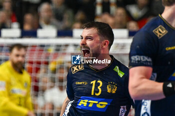 2024-01-28 - Happiness of Sebastian Carl Percy Karlsson (Sweden) after scores a goal during 3rd and 4th place final of the Men’s EHF Euro 2024 match between Sweden vs Germany at the Lanxess Arena, Cologne, Germany - MEN'S EHF EURO 2024 - PLACEMENT MATCH 3/4 - SWEDEN VS GERMANY  - HANDBALL - OTHER SPORTS