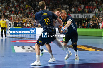 2024-01-28 - Nils Lichtlein (Germany) in action against Felix Claar (Sweden) during 3rd and 4th place final of the Men’s EHF Euro 2024 match between Sweden vs Germany at the Lanxess Arena, Cologne, Germany - MEN'S EHF EURO 2024 - PLACEMENT MATCH 3/4 - SWEDEN VS GERMANY  - HANDBALL - OTHER SPORTS