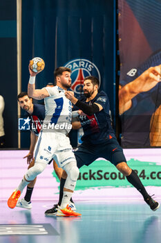 2024-03-06 - Miguel Martins of Pick Szeged and Nikola Karabatic of PSG during the EHF Champions League, Group A handball match between Paris Saint-Germain and OTP Bank - Pick Szeged on March 6, 2024 at Pierre de Coubertin stadium in Paris, France - HANDBALL - CHAMPIONS LEAGUE - PARIS SG V PICK SZEGED - HANDBALL - OTHER SPORTS