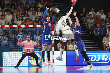 2024-05-11 - Aboubakar FOFANA of United States and Ludovic FABREGAS of France and Luka KARABATIC of France and Samir BELLAHCENE of France during the International Friendly Handball match between France and United States on May 11, 2024 at LDLC Arena in Décines-Charpieu near Lyon, France - HANDBALL - FRIENDLY GAME - FRANCE V UNITED STATES - HANDBALL - OTHER SPORTS