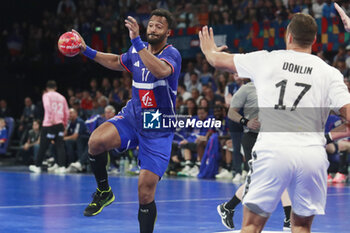 2024-05-11 - Timothey N’GUESSAN of France and Drew DONLIN of United States during the International Friendly Handball match between France and United States on May 11, 2024 at LDLC Arena in Décines-Charpieu near Lyon, France - HANDBALL - FRIENDLY GAME - FRANCE V UNITED STATES - HANDBALL - OTHER SPORTS