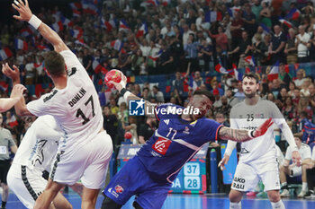 2024-05-11 - Nicolas TOURNAT of Lyon and Drew DONLIN of United States during the International Friendly Handball match between France and United States on May 11, 2024 at LDLC Arena in Décines-Charpieu near Lyon, France - HANDBALL - FRIENDLY GAME - FRANCE V UNITED STATES - HANDBALL - OTHER SPORTS