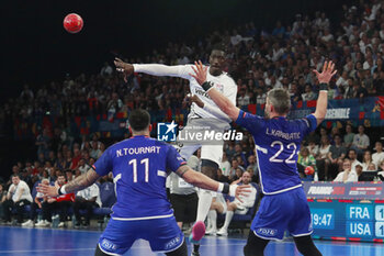 2024-05-11 - Aboubakar FOFANA of United States and Luka KARABATIC of France and Nicolas TOURNAT of Lyon during the International Friendly Handball match between France and United States on May 11, 2024 at LDLC Arena in Décines-Charpieu near Lyon, France - HANDBALL - FRIENDLY GAME - FRANCE V UNITED STATES - HANDBALL - OTHER SPORTS