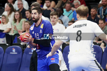 2024-05-11 - Nikola KARABATIC of France and PAUL SKORUPA of United States during the International Friendly Handball match between France and United States on May 11, 2024 at LDLC Arena in Décines-Charpieu near Lyon, France - HANDBALL - FRIENDLY GAME - FRANCE V UNITED STATES - HANDBALL - OTHER SPORTS