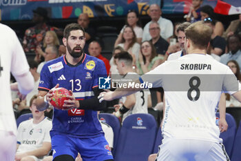 2024-05-11 - Nikola KARABATIC of France and PAUL SKORUPA of United States during the International Friendly Handball match between France and United States on May 11, 2024 at LDLC Arena in Décines-Charpieu near Lyon, France - HANDBALL - FRIENDLY GAME - FRANCE V UNITED STATES - HANDBALL - OTHER SPORTS