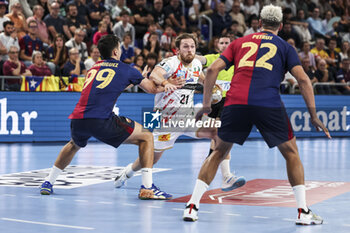 24/10/2024 - Albin Lagergren of SC Magdeburg and Javier Rodriguez of FC Barcelona during the EHF Champions League, Group Phase, handball match between FC Barcelona and SC Magdeburg on October 24, 2024 at Palau Blaugrana in Barcelona, Spain - HANDBALL - CHAMPIONS LEAGUE - BARCELONA V MAGDEBURG - PALLAMANO - ALTRO