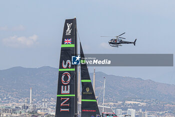 2024-08-30 - Ineos Britania (UK) and helicopter - AMERICA'S CUP - LOUIS VUITTON CUP - ROUND ROBIN 1 & 2 - SAILING - OTHER SPORTS