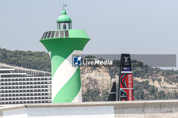 2024-09-01 - Sail of Emirates Team New Zealand (NZ) and lighthouse - AMERICA'S CUP - LOUIS VUITTON CUP - ROUND ROBIN 1 & 2 - SAILING - OTHER SPORTS