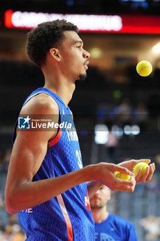 2024-07-06 - Victor Wembanyama of France warms up during the International Friendly Basketball match between Germany and France on 6 July 2024 at Lanxess Arena in Cologne, Germany - BASKETBALL - FRIENDLY GAME - GERMANY V FRANCE - FRIENDLY MATCH - BASKETBALL