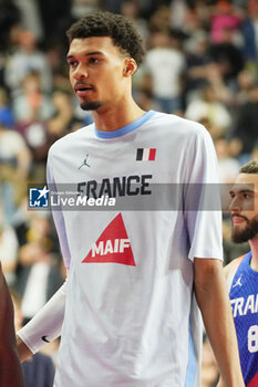 2024-07-06 - Victor Wembanyama of France warms up during the International Friendly Basketball match between Germany and France on 6 July 2024 at Lanxess Arena in Cologne, Germany - BASKETBALL - FRIENDLY GAME - GERMANY V FRANCE - FRIENDLY MATCH - BASKETBALL