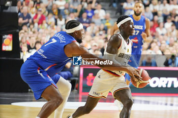 2024-07-06 - Dennis Schroder of Germany and Guerschon Yabusele of France during the International Friendly Basketball match between Germany and France on 6 July 2024 at Lanxess Arena in Cologne, Germany - BASKETBALL - FRIENDLY GAME - GERMANY V FRANCE - FRIENDLY MATCH - BASKETBALL