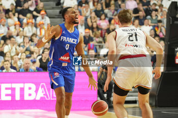 2024-07-06 - Élie Okobo of France during the International Friendly Basketball match between Germany and France on 6 July 2024 at Lanxess Arena in Cologne, Germany - BASKETBALL - FRIENDLY GAME - GERMANY V FRANCE - FRIENDLY MATCH - BASKETBALL