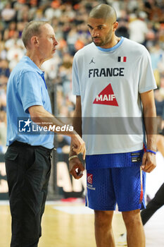 2024-07-06 - Head coach Vincent Collet with Nicolas Batum of France during the International Friendly Basketball match between Germany and France on 6 July 2024 at Lanxess Arena in Cologne, Germany - BASKETBALL - FRIENDLY GAME - GERMANY V FRANCE - FRIENDLY MATCH - BASKETBALL