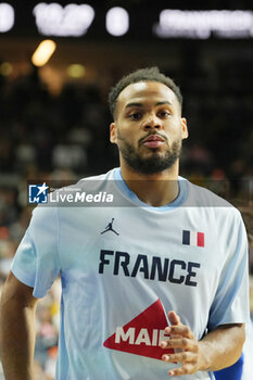 2024-07-06 - Élie Okobo of France warms up during the International Friendly Basketball match between Germany and France on 6 July 2024 at Lanxess Arena in Cologne, Germany - BASKETBALL - FRIENDLY GAME - GERMANY V FRANCE - FRIENDLY MATCH - BASKETBALL