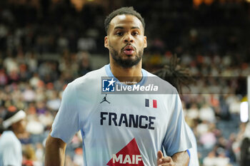 2024-07-06 - Élie Okobo of France warms up during the International Friendly Basketball match between Germany and France on 6 July 2024 at Lanxess Arena in Cologne, Germany - BASKETBALL - FRIENDLY GAME - GERMANY V FRANCE - FRIENDLY MATCH - BASKETBALL