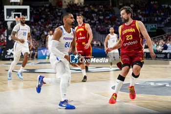 2024-07-23 - Gian Clavell (L) of Puerto Rico in action against Sergio Llull (R) of Spain during the Basketball International Friendly match between Spain and Puerto Rico at WiZink Center on July 23, 2024 in Madrid, Spain. - SPAIN VS PUERTO RICO - FRIENDLY MATCH - BASKETBALL