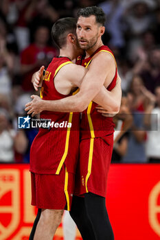 2024-07-23 - Rudy Fernandez (R) of Spain seen hugging Dario Brizuela (L) during the Basketball International Friendly match between Spain and Puerto Rico at WiZink Center on July 23, 2024 in Madrid, Spain. - SPAIN VS PUERTO RICO - FRIENDLY MATCH - BASKETBALL