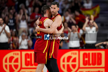 2024-07-23 - Rudy Fernandez (R) of Spain seen hugging Dario Brizuela (L) during the Basketball International Friendly match between Spain and Puerto Rico at WiZink Center on July 23, 2024 in Madrid, Spain. - SPAIN VS PUERTO RICO - FRIENDLY MATCH - BASKETBALL