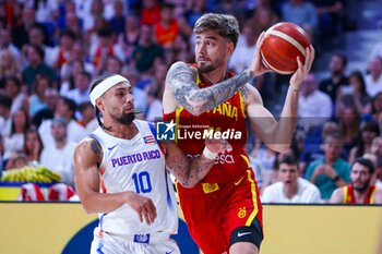 2024-07-23 - 23th July 2024; Wizink Center; Madrid; Spain; Friendly match; Olympic Games; Spain vs Puerto Rico; Juancho Hernangomez (Spain) and Alvarado (Puerto Rico)Basketball friendly match before Olympic Games Spain vs Puerto Rico 900/Cordon Press - BASKETBALL FRIENDLY MATCH BEFORE OLYMPIC GAMES SPAIN VS PUERTO RICO - FRIENDLY MATCH - BASKETBALL