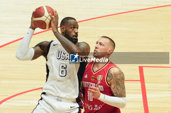 2024-07-22 - Lebron James of Usa and Daniel Theis of Germany during the International Friendly basketball match between USA and Germany on 22 July 2024 at O2 Arena in London, England - BASKETBALL - FRIENDLY GAME - USA V GERMANY - FRIENDLY MATCH - BASKETBALL