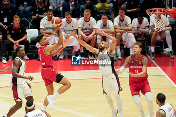 2024-07-22 - Maodo Lô of Germany and Derrick White of Usa during the International Friendly basketball match between USA and Germany on 22 July 2024 at O2 Arena in London, England - BASKETBALL - FRIENDLY GAME - USA V GERMANY - FRIENDLY MATCH - BASKETBALL