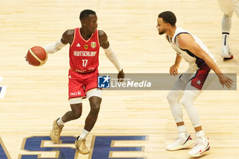 2024-07-22 - Dennis Schröder of Germany and Stephen Curry of Usa during the International Friendly basketball match between USA and Germany on 22 July 2024 at O2 Arena in London, England - BASKETBALL - FRIENDLY GAME - USA V GERMANY - FRIENDLY MATCH - BASKETBALL