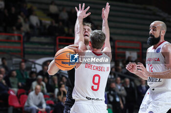 2024-11-13 - #9 Trey Drechsel (SL Benfica) and # 12 Arturs Strautins (Bertram Derthona Basket Tortona) - BETRAM DERTHONA VS SL BENFICA - CHAMPIONS LEAGUE - BASKETBALL