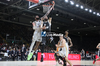 2024-03-15 - Tornike Shengelia (Segafredo Virtus Bologna) (L) in action thwarted by Vincent Poirier (Real Madrid) during the Euroleague basketball championship match Segafredo Virtus Bologna Vs. Real Madrid. Bologna, March 15, 2024 at Segafredo Arena - VIRTUS SEGAFREDO BOLOGNA VS REAL MADRID - EUROLEAGUE - BASKETBALL