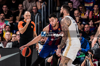 2024-01-03 - Willy Hernangomez of Fc Barcelona in action against Vincent Poirier of Real Madrid during the Turkish Airlines EuroLeague basketball match between FC Barcelona and Real Madrid on January 3, 2024 at Palau Blaugrana in Barcelona, Spain - BASKETBALL - EUROLEAGUE - FC BARCELONA V REAL MADRID - EUROLEAGUE - BASKETBALL