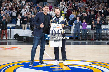 2024-01-11 - Former player Felipe Reyes (L) seen giving a commemorative shirt of the 1047 matches played by Sergio Llull (R) of Real Madrid before the Euroleague basketball match between Real Madrid and Valencia at Wizink Center in Madrid, Spain. - REAL MADRID VS VALENCIA - EUROLEAGUE - BASKETBALL