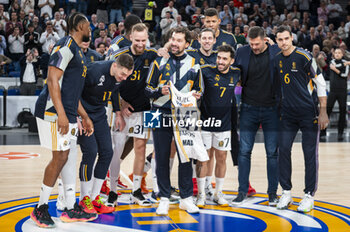 2024-01-11 - Sergio Llull of Real Madrid seen receiving seen a commemorative shirt of the 1047 matches and celebrating with all the team before the Euroleague basketball match between Real Madrid and Valencia at Wizink Center in Madrid, Spain. - REAL MADRID VS VALENCIA - EUROLEAGUE - BASKETBALL