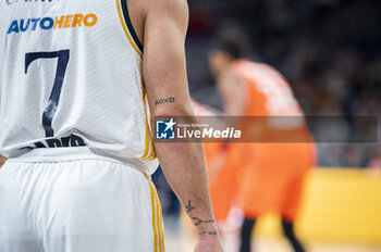 2024-01-11 - A detail of a tattoo of Facundo Campazzo of Real Madrid during the Euroleague basketball match between Real Madrid and Valencia at Wizink Center in Madrid, Spain. - REAL MADRID VS VALENCIA - EUROLEAGUE - BASKETBALL