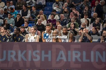 2024-01-11 - Fabien Causeur (L), Edy Tavares (C) and Guerschon Yabusele (R) of Real Madrid seen sitting on the bench during the Euroleague basketball match between Real Madrid and Valencia at Wizink Center in Madrid, Spain. - REAL MADRID VS VALENCIA - EUROLEAGUE - BASKETBALL