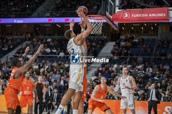 2024-01-11 - Edy Tavares of Real Madrid seen shooting the ball during the Euroleague basketball match between Real Madrid and Valencia at Wizink Center in Madrid, Spain. - REAL MADRID VS VALENCIA - EUROLEAGUE - BASKETBALL