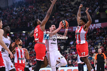 2024-03-21 - 12 Nando De Colo of LDLC ASVEL Villeurbanne competing with 2 Moses Wright of Olympiacos Piraeus during the Euroleague, Round 31, match between Olympiacos Piraeus and LDLC ASVEL Villeurbanne at Peace & Friendship Stadium on March 21, 2024, in Piraeus, Greece. - OLYMPIACOS PIRAEUS VS LDLC ASVEL VILLEURBANNE - EUROLEAGUE - BASKETBALL