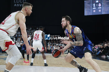 2024-03-28 - Joffrey LAUVERGNE of Lyon and Donatas MOTIEJUNAS of Monaco during the Turkish Airlines EuroLeague basketball match between LDLC ASVEL Villeurbanne and AS Monaco on March 28, 2024 at LDLC Arena in Decines-Charpieu, France - BASKETBALL - EUROLEAGUE - ASVEL V MONACO - EUROLEAGUE - BASKETBALL