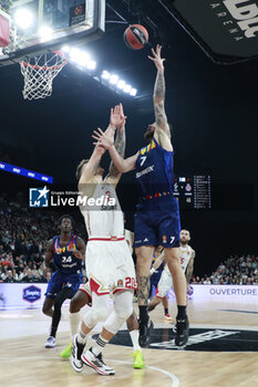 2024-03-28 - Joffrey LAUVERGNE of Lyon and Donatas MOTIEJUNAS of Monaco during the Turkish Airlines EuroLeague basketball match between LDLC ASVEL Villeurbanne and AS Monaco on March 28, 2024 at LDLC Arena in Decines-Charpieu, France - BASKETBALL - EUROLEAGUE - ASVEL V MONACO - EUROLEAGUE - BASKETBALL