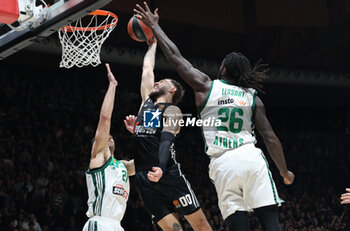 2024-11-15 - Isaia Cordinier (Virtus Bologna) in action thwarted by Ioannis Papapetrou (Athens) and Mathias Lessort (Athens) during the basketball Turkish Airlines Euroleague match between Virtus Segafredo Bologna and Panathinaikos Aktor Athens at the Unipol Arena, Casalecchio (Bologna), Italy, November 15, 2024 - photo: Michele Nucci - SEGAFREDO VIRTUS BOLOGNA VS PANATHINAIKOS AKTOR ATHENS - EUROLEAGUE - BASKETBALL