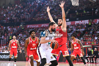 2024-10-15 - 33 Nikola Mirotic of EA7 Emporio Armani Milan competing with 25 Alec Peters of Olympiacos Piraeus during the Euroleague, Round 3 match between Olympiacos Piraeus and EA7 Emporio Armani Milan at Peace and Friendship Stadium on October 15, 2024, Piraeus, Greece. - OLYMPIACOS VS EA7 EMPORIO ARMANI MILAN - EUROLEAGUE - BASKETBALL