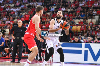 2024-10-15 - 33 Nikola Mirotic of EA7 Emporio Armani Milan competing with 14 Sasha Vezenkov of Olympiacos Piraeus during the Euroleague, Round 3 match between Olympiacos Piraeus and EA7 Emporio Armani Milan at Peace and Friendship Stadium on October 15, 2024, Piraeus, Greece. - OLYMPIACOS VS EA7 EMPORIO ARMANI MILAN - EUROLEAGUE - BASKETBALL