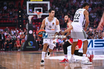 2024-10-29 - 6 Alberto Abalde of Real Madrid competing with 25 Alec Peters of Olympiacos Piraeus during the Euroleague, Round 6 match between Olympiacos Piraeus and Real Madrid at Peace and Friendship Stadium on October 29, 2024, Piraeus, Greece. - OLYMPIACOS VS REAL MADRID - EUROLEAGUE - BASKETBALL