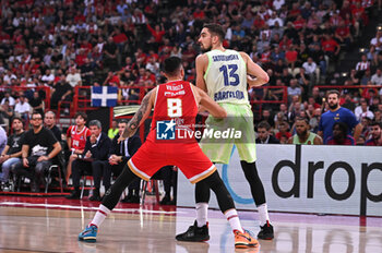 2024-10-31 - 13 Tomas Satoransky of FC Barcelona competing with 8 Luca Vildoza of Olympiacos Piraeus during the Euroleague, Round 7 match between Olympiacos Piraeus and FC Barcelona at Peace and Friendship Stadium in Piraeus, Greece, on October 31, 2024. - OLYMPIACOS VS FC BARCELONA - EUROLEAGUE - BASKETBALL